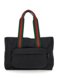 Gucci Men Black Tote Bag With Web Handles And Logo Lettering On The Front In Tech Fabric Man