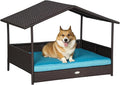 PawHut Wicker Dog House Outdoor with Canopy, Rattan Dog Bed with Water-Resistant Cushion, Raised Dog Bed for Small, Medium Dogs up to 66 lbs, 19.75" in Length, Brown Wicker, Blue Cushion