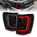 ANZO 1999-2004 Jeep Grand Cherokee LED Tail Lights w/ Light Bar Black Housing Smoke Lens 311395