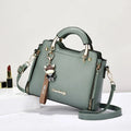 Printed monogram straddle leather bag.
