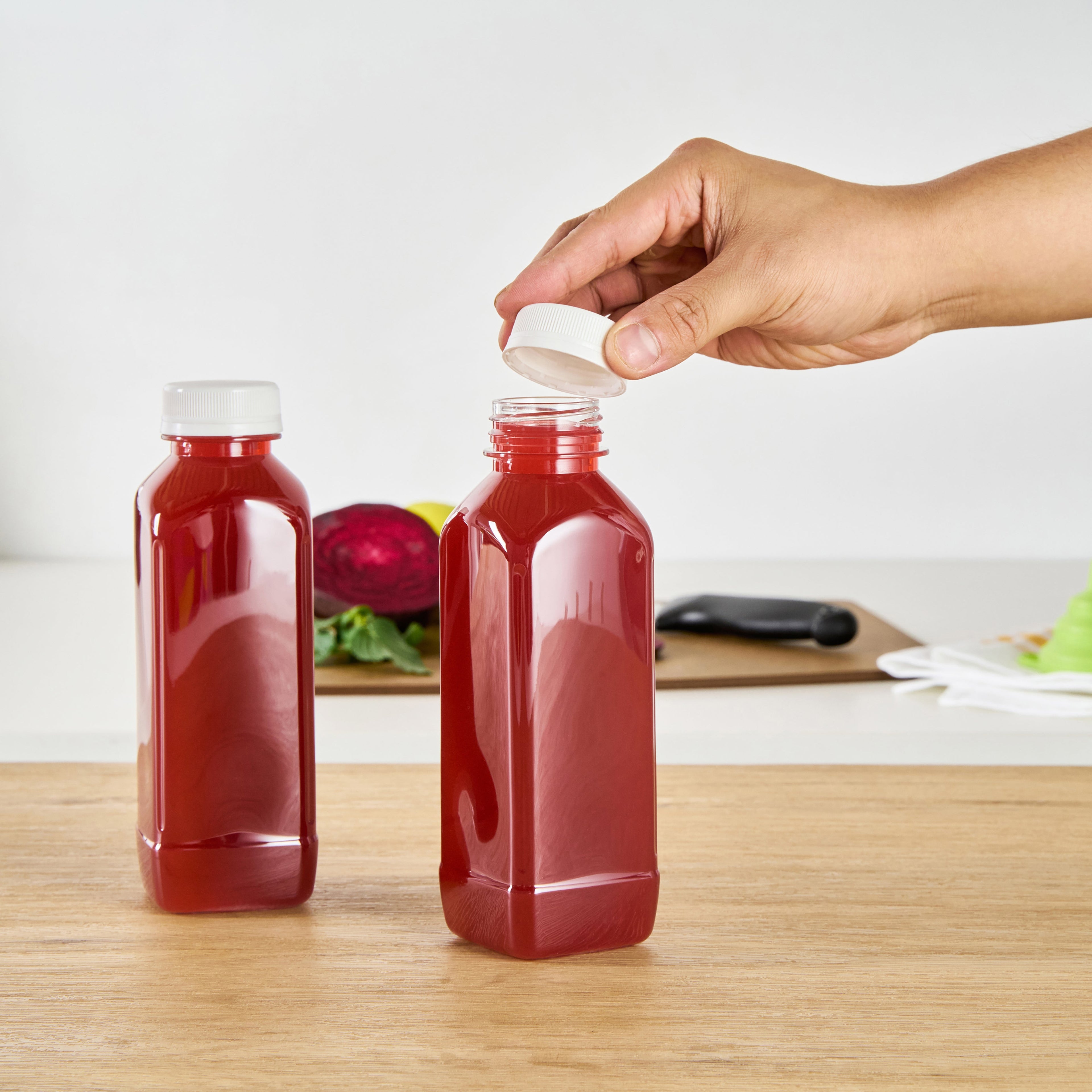 Bottle Tek 16 oz Square Clear Plastic Cold Pressed Juice Bottle - with Safety Cap - 2 1/4" x 2 1/4" x 7" - 100 count box