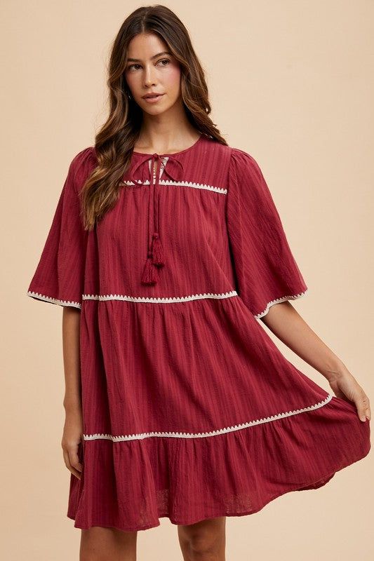 Tassel Contrast Trim Tie Neck Half Sleeve Tiered Dress – Bohemian-Inspired Dress with Tassel Details, Adjustable Tie Neck, and Tiered Design for a Flowing, Feminine Silhouette
