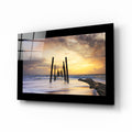 Old Pier Pilings Sunset Glass Wall Art