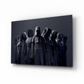 Hooded Figures in Shadow Glass Wall Art